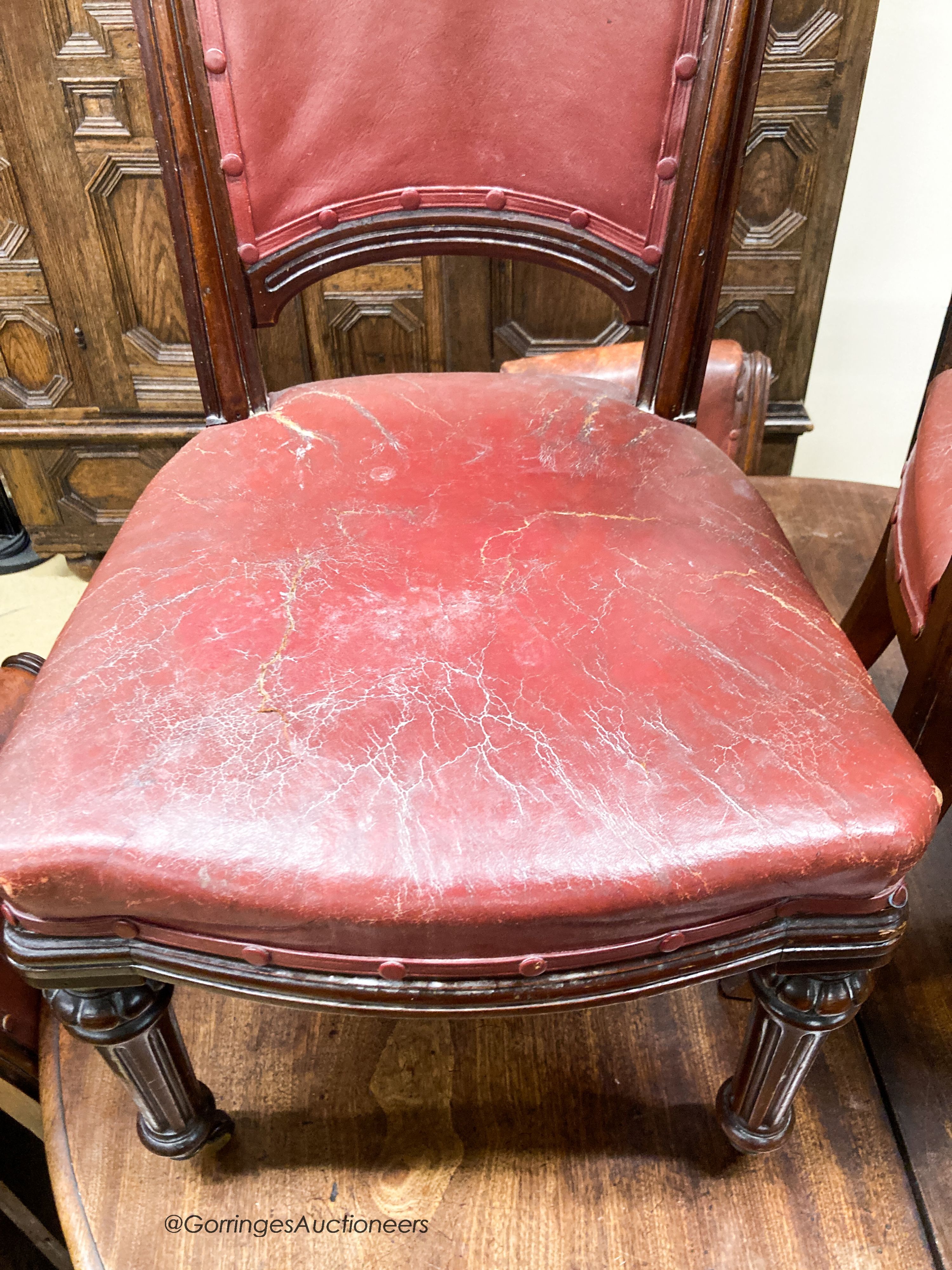 A set of six Victorian leather and mahogany dining chairs